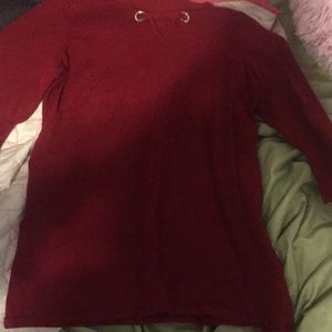 Red sweater, with a cross latch in the front